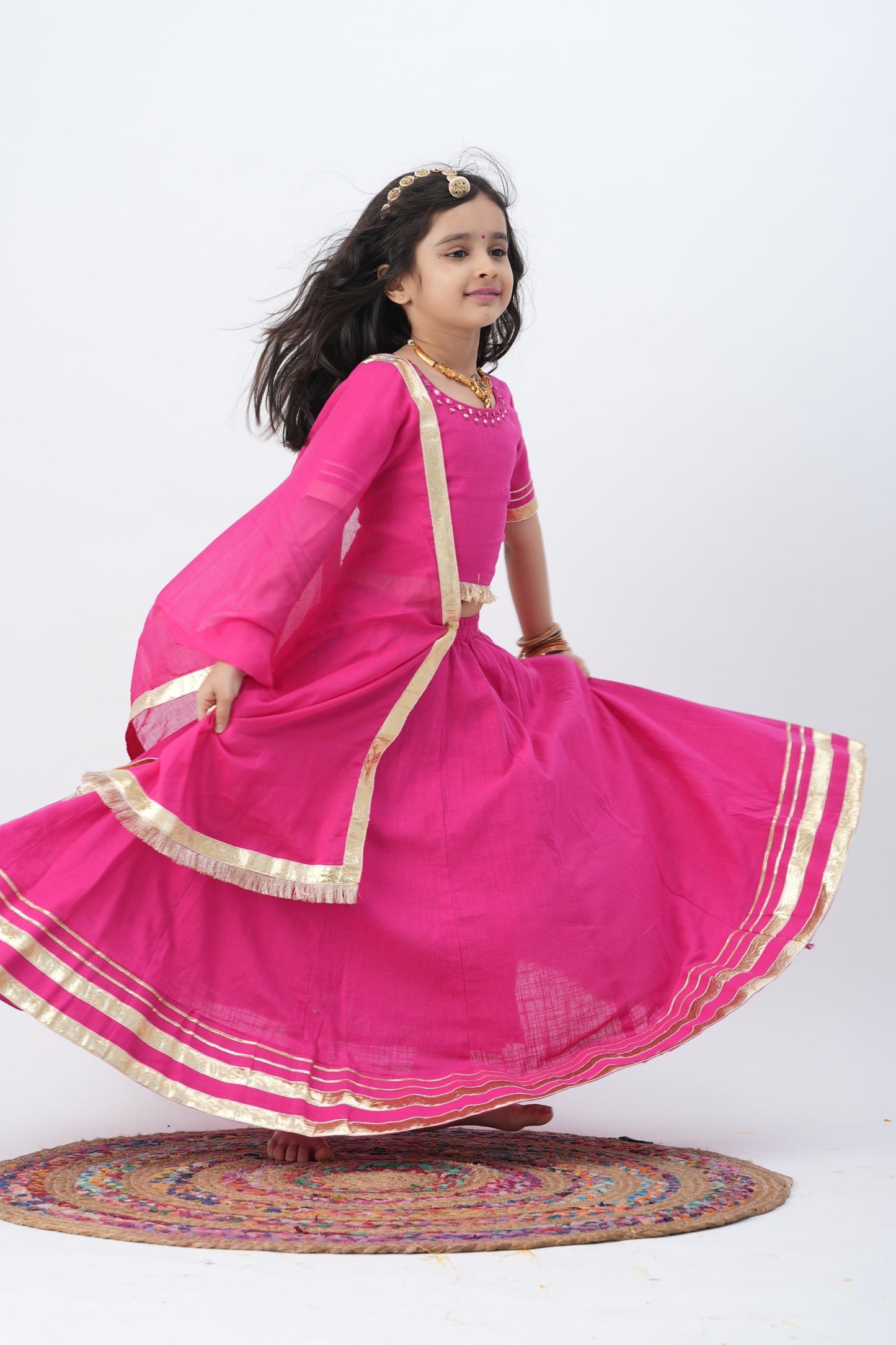Festive Fuchsia Charm :n Kids Lehenga with Mirror Work and Golden Accents