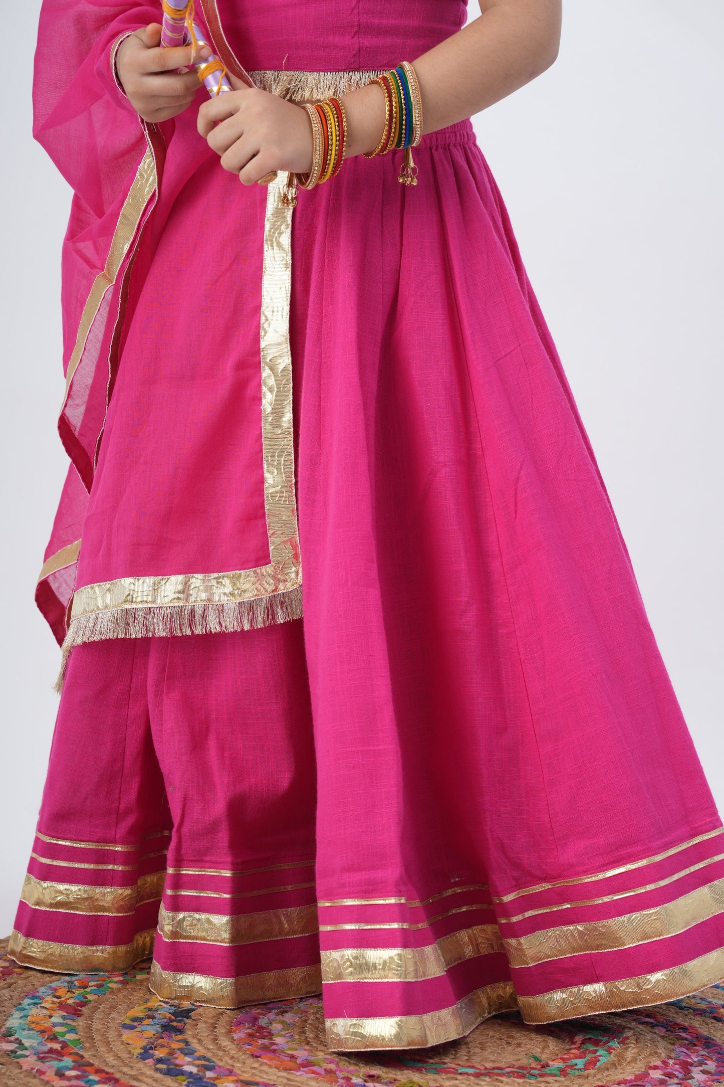 Festive Fuchsia Charm :n Kids Lehenga with Mirror Work and Golden Accents